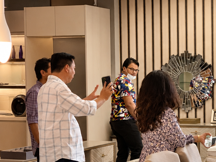 Guests touring a furnished interior together