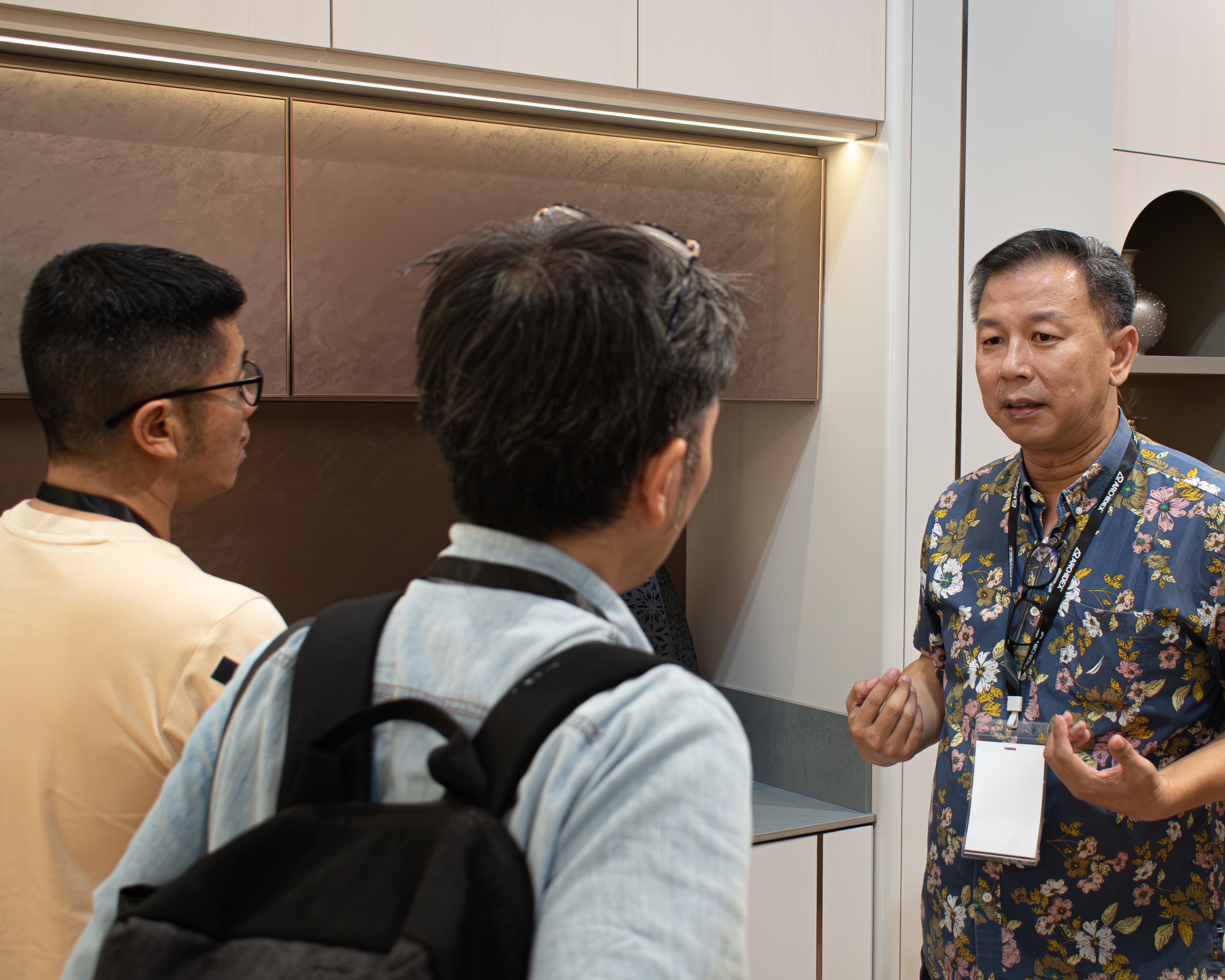 Novel Interior representative speaking with visitors
