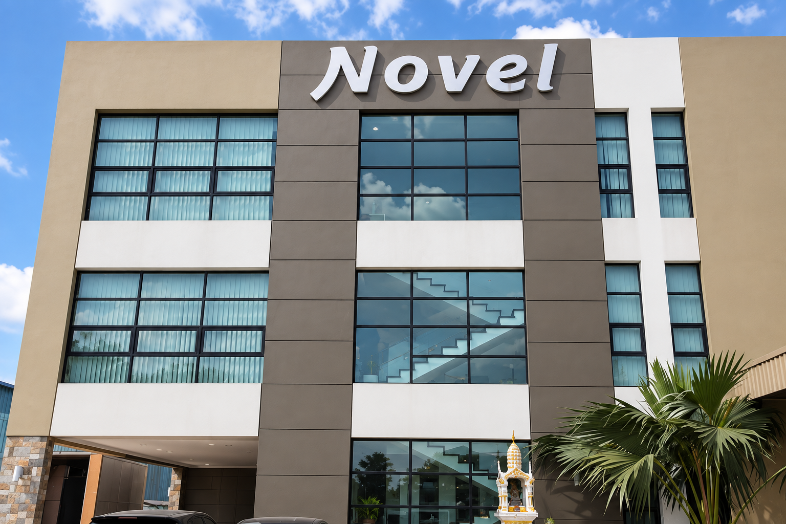 Frontal view of Novel Interior's headquarters beneath a blue sky