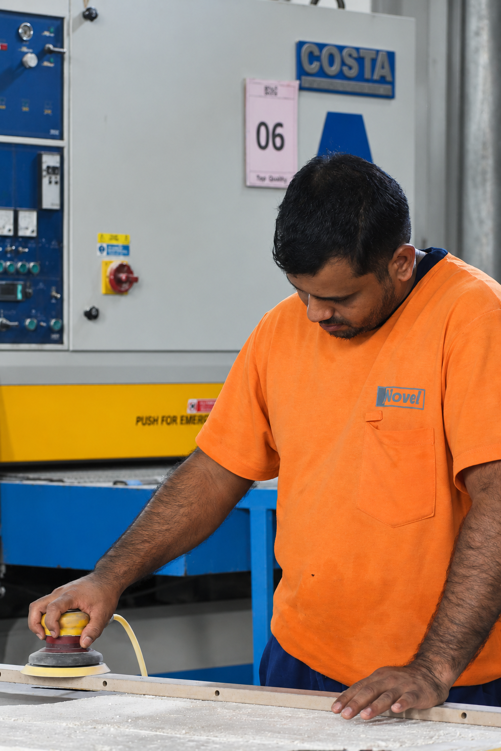 Novel Interior craftsman sanding a workpiece
